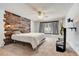Main bedroom with wood feature wall and large TV at 2938 Daybreak Dr, Orlando, FL 32825