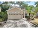 Two-story house with a two-car garage and paver driveway at 2938 Daybreak Dr, Orlando, FL 32825