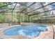 Relaxing screened-in pool and spa area at 2938 Daybreak Dr, Orlando, FL 32825