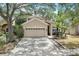 Two-story house with a two-car garage and paver driveway at 2938 Daybreak Dr, Orlando, FL 32825