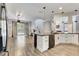 Modern kitchen with white cabinets, granite countertops, and stainless steel appliances at 2938 Daybreak Dr, Orlando, FL 32825