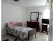 Bedroom with double bed, dresser, and TV at 933 W Oak Ridge Rd # 933 B, Orlando, FL 32809