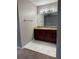 Bathroom features granite vanity and updated fixtures at 5132 Conroy Rd # 937, Orlando, FL 32811
