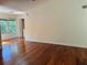 Spacious living room featuring wood floors and large windows at 5132 Conroy Rd # 937, Orlando, FL 32811