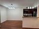 Charming dining area with hardwood floors and kitchen access at 5132 Conroy Rd # 937, Orlando, FL 32811