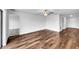 Bright living room with wood-look floors and access to other rooms at 4305 Carrabelle River Ln, Lakeland, FL 33811