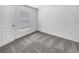Simple bedroom with neutral carpeting and window coverings at 4305 Carrabelle River Ln, Lakeland, FL 33811