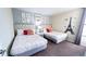 Two twin beds with Parisian themed decor and pink accents at 2965 Fable St, Kissimmee, FL 34746