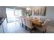 Elegant dining room with large table and seating for eight at 2965 Fable St, Kissimmee, FL 34746