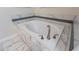 Oval bathtub with marble tile surround in a bright bathroom at 2965 Fable St, Kissimmee, FL 34746