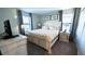 King-size bed, nightstands, TV, and tasteful decor at 2965 Fable St, Kissimmee, FL 34746