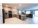 Modern kitchen with stainless steel appliances and an island at 2965 Fable St, Kissimmee, FL 34746