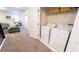 Convenient laundry room with washer, dryer, and shelving at 2965 Fable St, Kissimmee, FL 34746