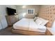 King-size bed with upholstered headboard and dresser at 2965 Fable St, Kissimmee, FL 34746