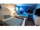 Charming bedroom with twin beds, Frozen-themed wall, and ample closet space at 2965 Fable St, Kissimmee, FL 34746