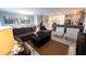 Spacious living room featuring a large sectional sofa, coffee table, and ample natural light at 2965 Fable St, Kissimmee, FL 34746