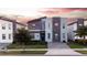 Modern home with stone accents and a landscaped yard at 2965 Fable St, Kissimmee, FL 34746