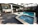 Enjoy this screened-in pool and spa area with plenty of space for lounging at 2965 Fable St, Kissimmee, FL 34746