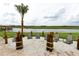 Relaxing sandy lounge area with chairs and lake views at 2965 Fable St, Kissimmee, FL 34746