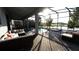 Screened patio with pool, spa, and comfortable seating at 2965 Fable St, Kissimmee, FL 34746