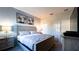 Comfortable bedroom with king bed, dresser and artwork at 2965 Fable St, Kissimmee, FL 34746