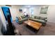 Cozy living room featuring comfortable sofas, a coffee table, and a TV at 2965 Fable St, Kissimmee, FL 34746