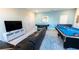 Game room featuring a large TV, pool table, and air hockey table at 2965 Fable St, Kissimmee, FL 34746