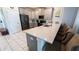 Modern kitchen with breakfast bar and stainless steel appliances at 2965 Fable St, Kissimmee, FL 34746