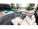 Relaxing pool and spa with lake view; outdoor patio furniture included at 2965 Fable St, Kissimmee, FL 34746