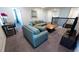 Upstairs loft area with seating and a view of the staircase at 2965 Fable St, Kissimmee, FL 34746