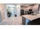 Modern kitchen with gray cabinets, stainless steel appliances, and a large island at 2965 Fable St, Kissimmee, FL 34746