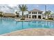 Resort-style pool with a large deck and cabana at 2965 Fable St, Kissimmee, FL 34746
