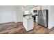 Modern kitchen with stainless steel appliances and an island at 4321 Carrabelle River Ln, Lakeland, FL 33811
