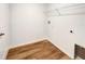 Laundry room with wire shelving and wood flooring at 4321 Carrabelle River Ln, Lakeland, FL 33811
