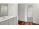 Clean bathroom with vanity, walk-in closet and hardwood floors at 4321 Carrabelle River Ln, Lakeland, FL 33811