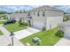 Two-story house with a two-car garage and landscaped yard at 418 Anne St, Deland, FL 32724