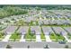Aerial view of neighborhood with houses and landscaping at 418 Anne St, Deland, FL 32724