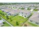 Aerial view showing house, backyard, and surrounding neighborhood at 418 Anne St, Deland, FL 32724