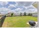 Large backyard with a grassy area and a grill at 418 Anne St, Deland, FL 32724