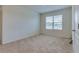 Simple bedroom with carpeted floor and a large window at 418 Anne St, Deland, FL 32724