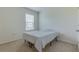 Cozy bedroom with carpeted floor and a queen-size bed at 418 Anne St, Deland, FL 32724