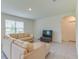 Comfortable living room with sectional sofa and flat-screen TV at 418 Anne St, Deland, FL 32724