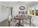Small dining area with round table and four chairs at 59 Chippingwood Ln, Ormond Beach, FL 32176