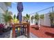 Private patio with table, chairs, and lush landscaping at 59 Chippingwood Ln, Ormond Beach, FL 32176