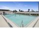 Community swimming pool with ample deck space for lounging at 59 Chippingwood Ln, Ormond Beach, FL 32176