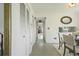 Clean hallway with white doors and tiled floors at 59 Chippingwood Ln, Ormond Beach, FL 32176