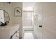 Clean bathroom with updated vanity, tub, and tile at 59 Chippingwood Ln, Ormond Beach, FL 32176