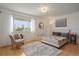 Bright bedroom with large window and hardwood floors at 59 Chippingwood Ln, Ormond Beach, FL 32176