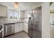 Updated kitchen featuring stainless steel appliances and white cabinets at 59 Chippingwood Ln, Ormond Beach, FL 32176