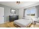 Bright bedroom with a double bed, dresser and large window at 59 Chippingwood Ln, Ormond Beach, FL 32176